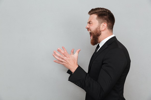 man-suit-shouting-gesturing-with-hands