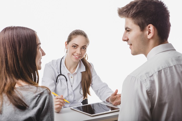 smiling-doctor-with-patients